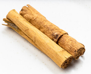 two sticks of continental ceylon cinnamon on gray