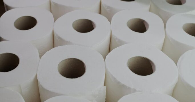 Slider 4k shot: Lots of toilet paper rolls.