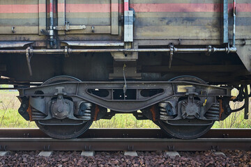 fragment of a train wagon with a close-up on the wheels © Robert