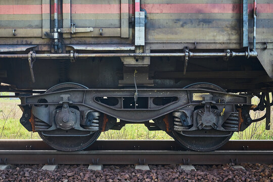 fragment of a train wagon with a close-up on the wheels