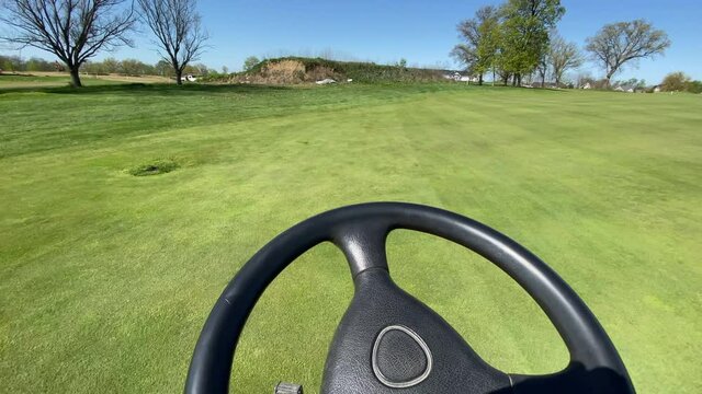 mowing a golf course fairway