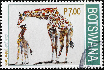 Giraffe and baby on postage stamp of Botswana