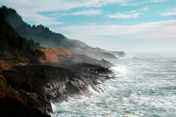 Fototapeta na wymiar Ocean waves crashing,Rocky coast and beach with ocean surf, Oregon Coast, USA