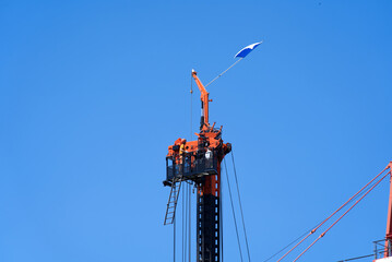 Top of tall mobile drilling machine at construction site with flag of city and canton of Zurich. Photo taken June 3rd, 2021, Zurich, Switzerland.