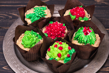 Cactus cupcakes decorated with sweet green and red cream