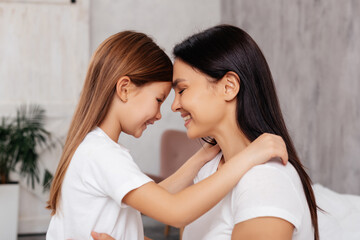 Cheerful woman spending time with her daughter
