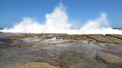 Wave burst on the rocks