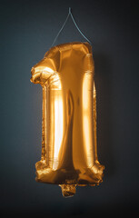 Gold foil Balloon number one isolated on black