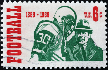 Centenary of american football on vintage postage stamp - obrazy, fototapety, plakaty