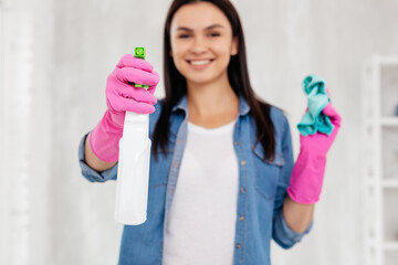 Sanitizer spray in hand of young woman
