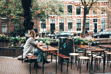 Young Woman Waits for a Friend in Amsterdam