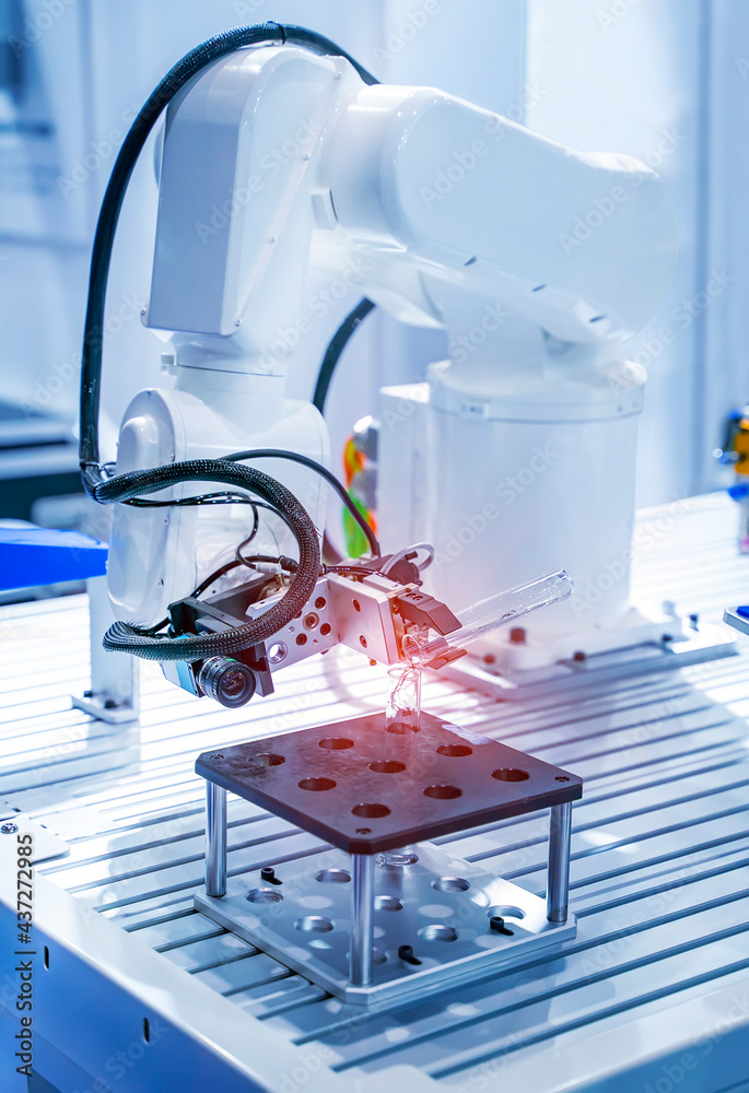 Wall mural robot arm with test tube with biological sample in science laboratory
