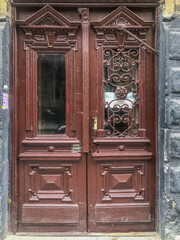 old door with glass with red paint