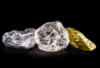 silver ore, gold nugget and rough diamond on black isolated background.