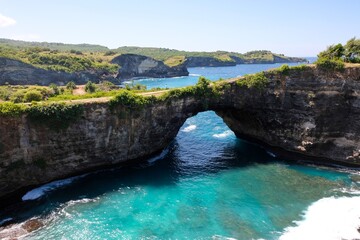 Naklejka premium Broken beach . Bali travel destination. Nusa Penida island day tour popular place. Amazing activity on beach holiday