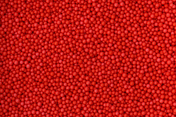 Red foam beads background. Valentine day