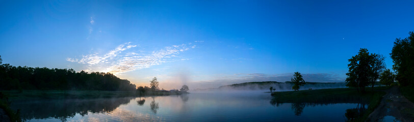 Panorama lake view in sunrise time .Sunrise at the lake