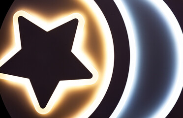 Modern high-tech LED chandelier on a black ceiling, close-up. LED chandelier on a black.