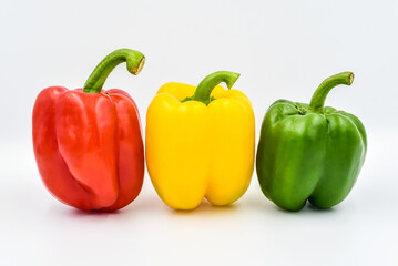 Obraz na płótnie Canvas Fresh sweet pepper (red , yellow, and green) on white background