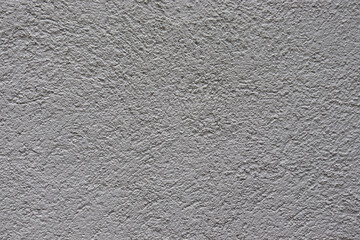 Gray texture background. Concrete wall. Rough surface. Stone texture. Uneven, scratched, lumpy.