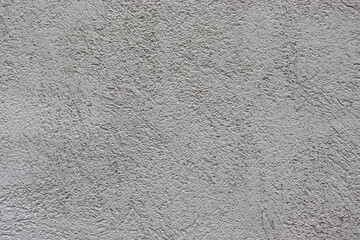 Gray texture background. Concrete wall. Rough surface. Stone texture. Uneven, scratched, lumpy.