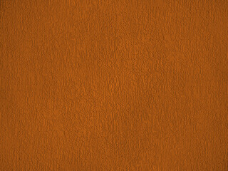 rough wall plaster brown color texture. Grunge scratched surface background.
