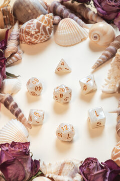 Vertical image of white and gold RPG dice