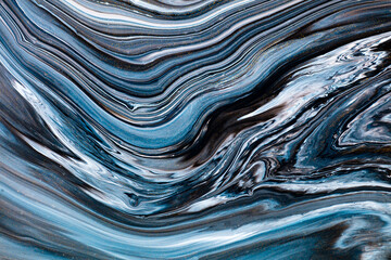 Fluid art texture. Backdrop with abstract swirling paint effect. Liquid acrylic picture with trendy mixed paints. Can be used for website background. Black, blue and white overflowing colors.