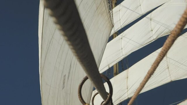 Mast with sails and ropes on old sail ship - windjammer, bark