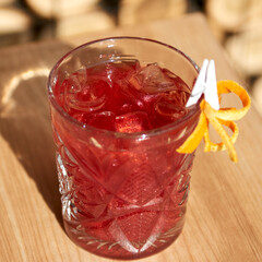 Cold coctails with lime, mint and ice in a glass with drops. Alcohol drink at the bar.