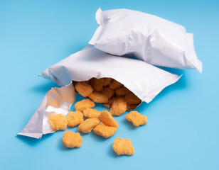 Corn puff snacks open bag packaging on blue background