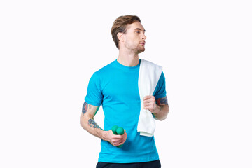 man with dumbbells in hands towel on shoulder workout fitness light background