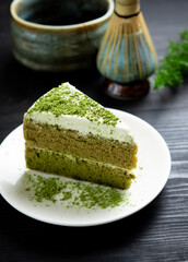 Japanese Matcha Green tea cake on wood, tea and cake