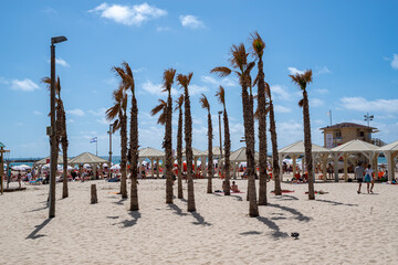  People sunbathes on the beach  in Tel Aviv, Israel