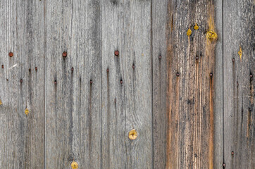 Gray old boards weathered in the weather. Old door