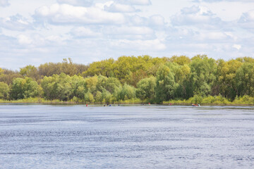 The embankment and the flood of the river in the spring in the city. Beautiful river landscape.the surface.