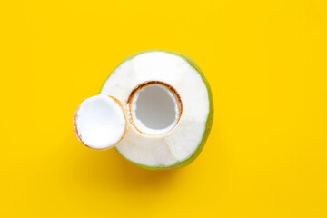 Fototapeta na wymiar Fresh green young coconut fruit on yellow background.