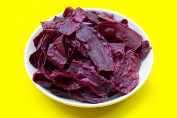 Purple sweet potato chips in white plate