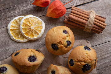 Fototapeta premium Homemade muffins on the rustic table - delicious pastries. Delicious dessert