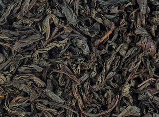 Background texture of dried black tea leaves. Chinese tea.