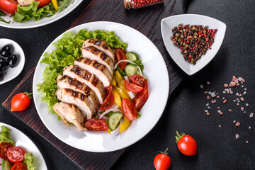 Fresh delicious salad with chicken, tomato, cucumber, onions and greens with olive oil
