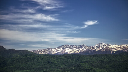 Fototapeta premium landscape snow covered mountains and blue sky