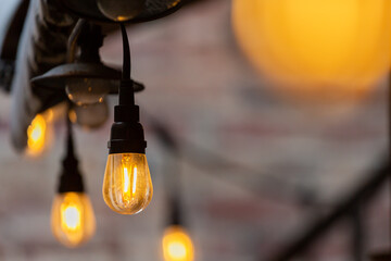 Yellow lightbulbs hanging in downtown Fort Myers