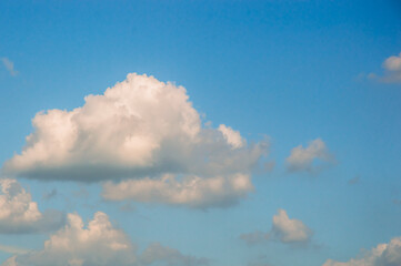 Background of white fluffy clouds in the blue sky.Close up