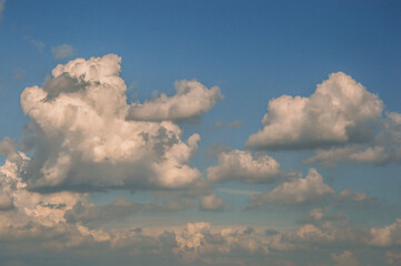 Background of white fluffy clouds in the blue sky.Close up