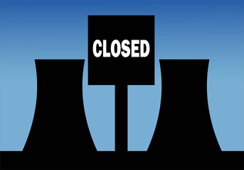 Central nuclear  con el letrero de cerrada entre las chimeneas