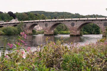 Fototapeta na wymiar Smeaton's Bridge across the River Tay in the city centre of Perth in Scotland. Select focus on the bridge.