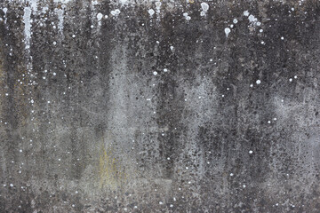 Fototapeta na wymiar old gray concrete wall with white paint stains