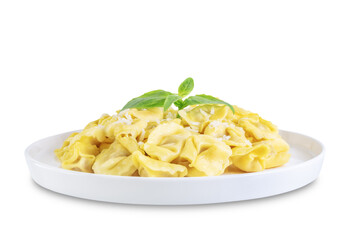 Fresh prepared Tortellini pasta with basil on a white isolated background