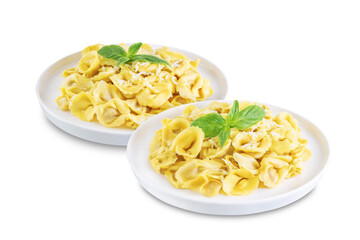 Fresh prepared Tortellini pasta with basil on a white isolated background